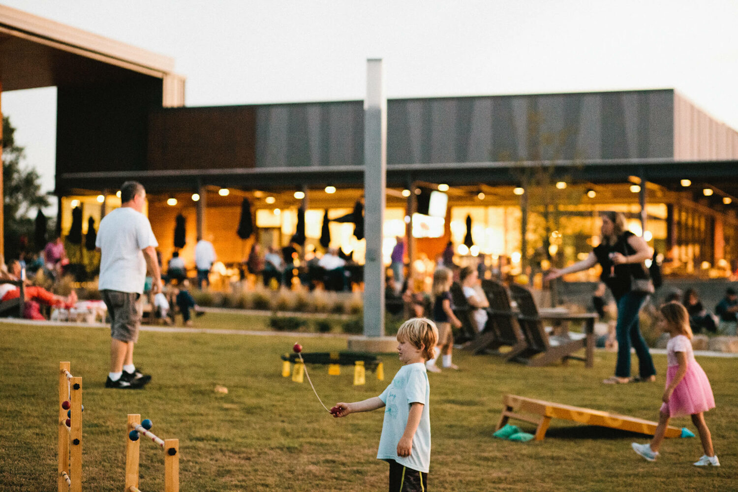 Family fun outside in Montgomery, Alabama at Montgomery Whitewater Park's outdoor restaurant and bar, Eddy's